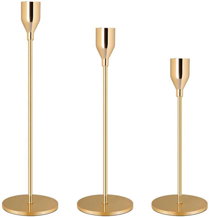 three candle holders  gold color